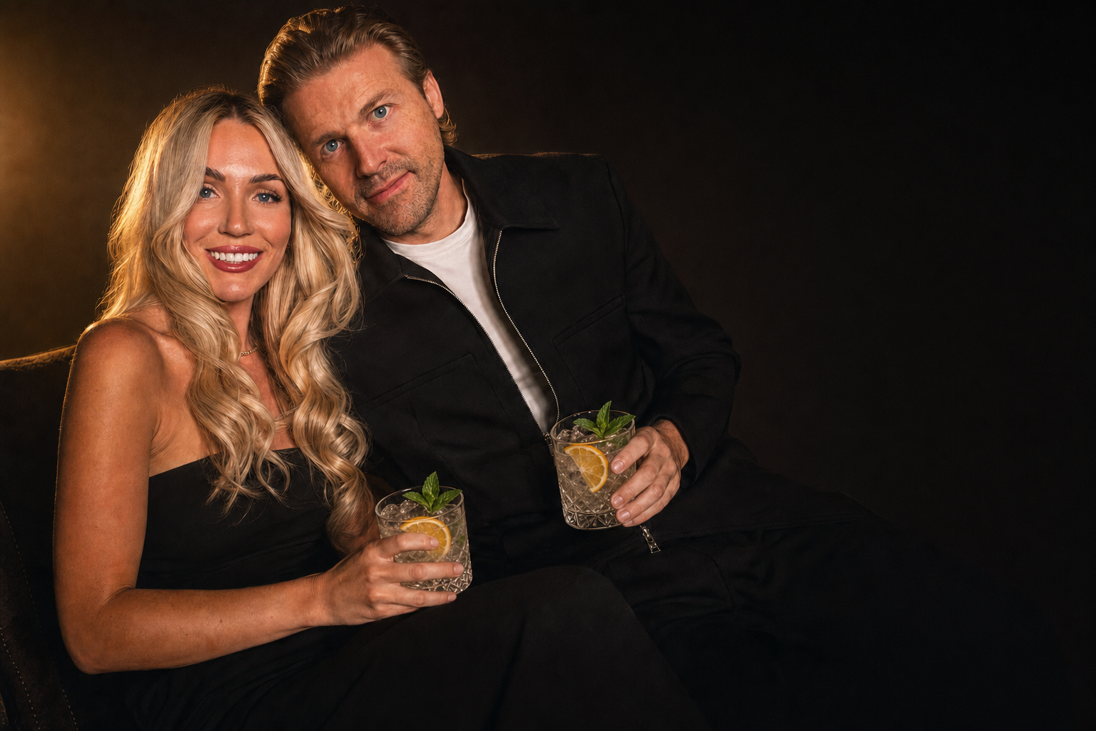 Joe and Allie Scott seated together in a cinematic studio setting